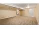 A spacious, carpeted basement with recessed lighting and a glimpse of stairs, ready for personalization at 12107 E Vassar Dr, Aurora, CO 80014