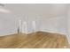 Expansive bedroom with hardwood floors and neutral walls at 12107 E Vassar Dr, Aurora, CO 80014