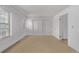 Neutral bedroom with carpeting, window, and ample closet space creating a blank canvas for customization at 12107 E Vassar Dr, Aurora, CO 80014
