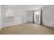 Bedroom features natural light, plush carpet, and a clean design ready for customization and personalization at 12107 E Vassar Dr, Aurora, CO 80014