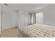 Comfortable bedroom with carpet, a bed, window, and large closet offering a cozy space ready for relaxation at 12107 E Vassar Dr, Aurora, CO 80014