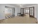 Dining area with tiled floor, chandelier, and view to the other living spaces at 12107 E Vassar Dr, Aurora, CO 80014