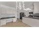 Bright kitchen featuring ample counter space, tile flooring, and modern appliances at 12107 E Vassar Dr, Aurora, CO 80014