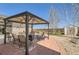 Outdoor patio with a pergola and comfortable seating, creating an inviting space for relaxation at 1141 Beech St, Fort Lupton, CO 80621