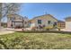 Expansive backyard featuring a manicured lawn, patio areas, and vibrant landscaping at 1141 Beech St, Fort Lupton, CO 80621