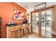 This cozy bar area features seating for three and access to the living room through gorgeous french doors at 1141 Beech St, Fort Lupton, CO 80621