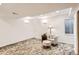 Basement featuring soft carpet, neutral decor, a comfortable seating area, and recessed lighting at 1141 Beech St, Fort Lupton, CO 80621