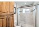 Bathroom featuring glass enclosed shower with coordinated tile, providing a modern and stylish touch at 1141 Beech St, Fort Lupton, CO 80621