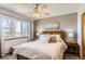 Comfortable bedroom with a large window, bedside tables, and soft lighting at 1141 Beech St, Fort Lupton, CO 80621