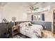 Bright bedroom featuring stylish wall accents, a ceiling fan, and comfortable decor at 1141 Beech St, Fort Lupton, CO 80621