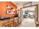 Open dining and bar area with modern lighting, creating a warm and inviting atmosphere for entertaining at 1141 Beech St, Fort Lupton, CO 80621
