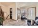Cozy entryway with plush carpet, a staircase, and views of the front porch at 1141 Beech St, Fort Lupton, CO 80621