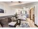 Cozy living room and bedroom combo offering a comfortable space with soft furnishings and lots of light at 1141 Beech St, Fort Lupton, CO 80621