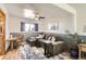 Cozy living area featuring a comfortable sofa, desk, and ample natural light at 1141 Beech St, Fort Lupton, CO 80621