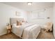 Inviting bedroom with soft lighting, neutral tones, a plush bed, and modern decor at 1243 N Washington St # 108, Denver, CO 80203