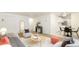 Bright living room featuring neutral colors, stylish furnishings, and an open layout leading into the kitchen at 1243 N Washington St # 108, Denver, CO 80203