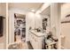Bright bathroom with double vanity, granite countertop, and walk-in closet at 1063 Gianna Ave, Fort Lupton, CO 80621