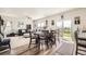 Inviting dining area with table and chairs, bathed in natural light from a sliding glass door at 1063 Gianna Ave, Fort Lupton, CO 80621