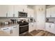 Well-equipped kitchen with stainless steel appliances, granite countertops, and ample cabinet space at 1063 Gianna Ave, Fort Lupton, CO 80621