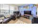 Home office with bright blue walls, natural light, and a comfortable chair at 1063 Gianna Ave, Fort Lupton, CO 80621