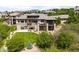 Large home with balconies and expansive green lawn and exterior patio space at 12775 Horizon Trl, Castle Pines, CO 80108