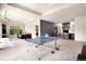 A large basement area features a ping pong table and a bar area for entertainment at 12775 Horizon Trl, Castle Pines, CO 80108