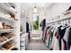 Walk-in closet with ample storage space and a window at 12775 Horizon Trl, Castle Pines, CO 80108