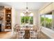 Bright dining room with hardwood floors and a decorative chandelier at 12775 Horizon Trl, Castle Pines, CO 80108