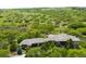Expansive home surrounded by lush greenery, blending luxury with the natural Colorado landscape at 12775 Horizon Trl, Castle Pines, CO 80108