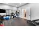 A home gym area featuring modern workout equipment and mirrored walls at 12775 Horizon Trl, Castle Pines, CO 80108