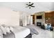 Bedroom featuring a fireplace, built-in shelving, and a ceiling fan at 12775 Horizon Trl, Castle Pines, CO 80108