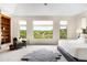 Bright main bedroom with natural light and built-in shelving at 12775 Horizon Trl, Castle Pines, CO 80108