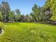 Lush backyard featuring a large, fenced-in lawn at 15224 W 73Rd Ave, Arvada, CO 80007
