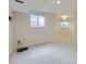 Spacious basement area with carpeted floor, natural light, and neutral paint, ready for customization at 15224 W 73Rd Ave, Arvada, CO 80007