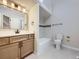 Bathroom featuring a modern sink, tile flooring, and bath/shower combination at 15224 W 73Rd Ave, Arvada, CO 80007