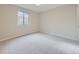 Bedroom featuring plush carpeting, neutral walls, a window, and closet at 15224 W 73Rd Ave, Arvada, CO 80007