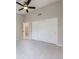 Bedroom featuring neutral walls, plush carpeting, ceiling fan, closet with sliding doors and access to another room at 15224 W 73Rd Ave, Arvada, CO 80007