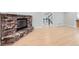 Bright living room with a brick fireplace and hardwood floors at 15224 W 73Rd Ave, Arvada, CO 80007