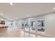 Spacious living room featuring natural light and hardwood floors with an adjacent serving area at 15224 W 73Rd Ave, Arvada, CO 80007