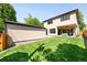 Expansive backyard with a lush lawn and patio, perfect for outdoor entertaining at 1241 S Garfield St, Denver, CO 80210