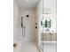 Modern bathroom featuring a walk-in shower with a bench and stylish fixtures at 1241 S Garfield St, Denver, CO 80210