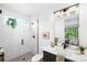 Stylish bathroom featuring a walk-in shower, sleek fixtures, and modern vanity area at 1241 S Garfield St, Denver, CO 80210