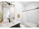 Bright bathroom with a vanity, tiled walls, and classic fixtures at 1241 S Garfield St, Denver, CO 80210