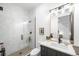 Modern bathroom featuring a walk-in shower, contemporary fixtures, and stylish design at 1241 S Garfield St, Denver, CO 80210