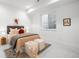 Cozy bedroom featuring soft textures, neutral tones, and ample natural light at 1241 S Garfield St, Denver, CO 80210