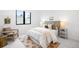 Bright, cozy bedroom featuring a comfortable bed, modern decor, and a sitting area at 1241 S Garfield St, Denver, CO 80210