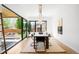 Bright dining area with modern lighting, patio access, and views of the backyard, perfect for entertaining at 1241 S Garfield St, Denver, CO 80210