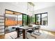 Bright dining area with modern lighting, patio access, and views of the backyard, perfect for entertaining at 1241 S Garfield St, Denver, CO 80210