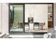 Elegant dining room with stylish light fixture, flows seamlessly to outdoor patio, creating an ideal entertainment space at 1241 S Garfield St, Denver, CO 80210