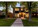 Charming two-story home with modern brickwork, large windows, and professional landscaping, offering great curb appeal at 1241 S Garfield St, Denver, CO 80210